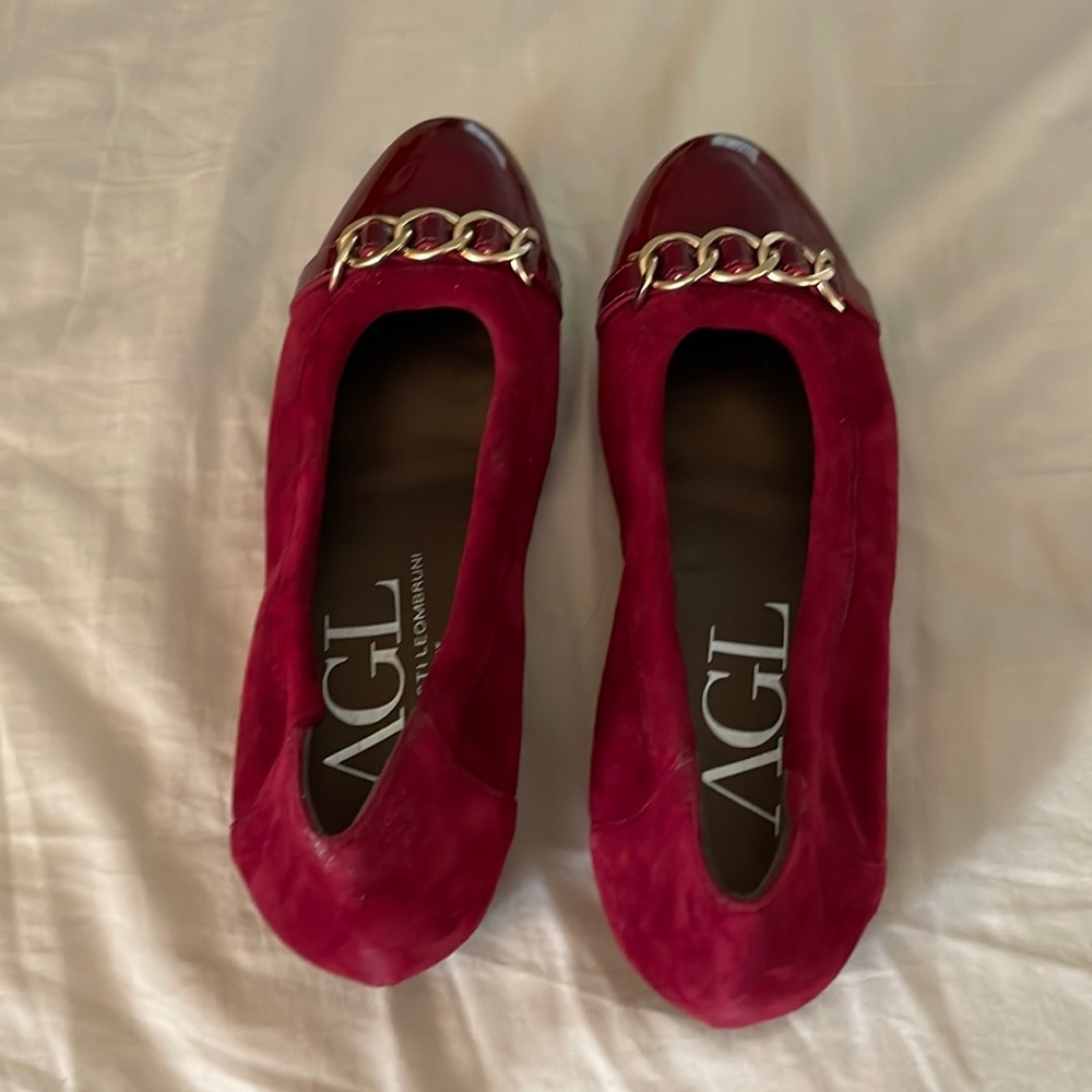 AGL worn once red flats size 38 1/2. Very comfortable.toe pattern leather